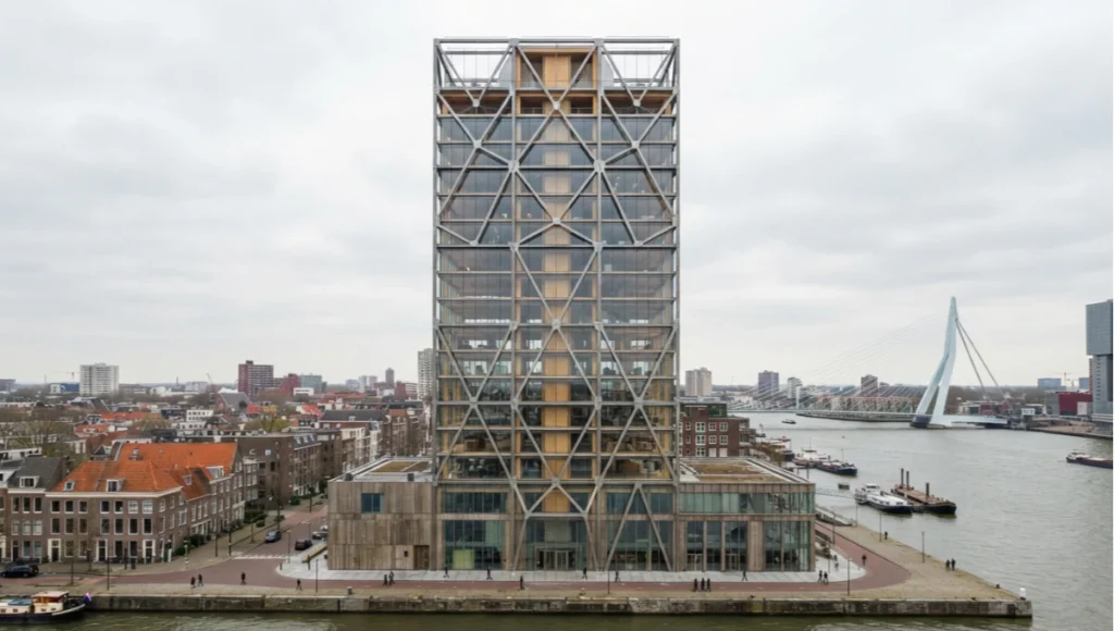 Speculative Nuvira Space concept render of Meridian Skin, a 34-story timber-hybrid tower in Rotterdam with an exposed steel diagrid and embedded quantum sensing nodes.